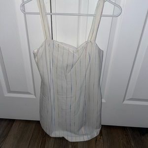 white mini dress with blue and pink stitch